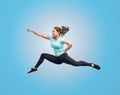 Happy sporty young woman jumping in fighting pose Royalty Free Stock Photo