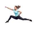 Happy sporty young woman jumping in fighting pose Royalty Free Stock Photo