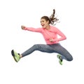 Happy sporty young woman jumping in fighting pose Royalty Free Stock Photo