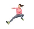 Happy sporty young woman jumping in fighting pose Royalty Free Stock Photo