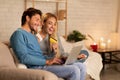 Happy Spouses Using Laptop And Online Shopping Card At Home Royalty Free Stock Photo