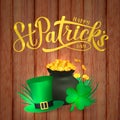 Happy St. Patrick s day calligraphy hand lettering, Leprechaun s hat, clover and pot of golden coins on wood background. Vector Royalty Free Stock Photo