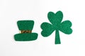 Happy St. PatrickÃ¢â¬â¢s Day. Green hat and three leaf clover isolated on white background.