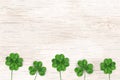 Happy St. Patrick`s day. St patricks day design with shamrock clover leaf, Irish festival symbol on wooden background