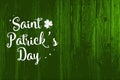 Happy St. Patrick`s Day Poster. Wooden background with white typography