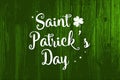 Happy St. Patrick`s Day Poster. Wooden background with white typography Royalty Free Stock Photo