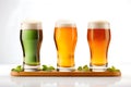 Happy St. Patrick\'s Day. Three glasses of different beer on a white background Royalty Free Stock Photo