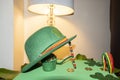 Happy St Patricks Day green leprechaun hat with gold covered chocolate coins Royalty Free Stock Photo