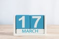 Happy St Patricks Days save the date. March 17th. Day 17 of month, daily calendar on wooden table background. Spring