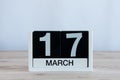 Happy St Patricks Days save the date. March 17th. Day 17 of month, everyday calendar on wooden table background. Spring