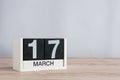 Happy St Patricks Days save the date. March 17th. Day 17 of month, wooden calendar on light background. Spring time