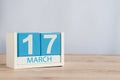 Happy St Patricks Days save the date. March 17th. Day 17 of month, wooden color calendar on table background. Spring