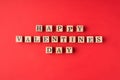 Happy St valentines day congrats concept. Flatlay close up view photo of wooden cubes making words isolated bright color backdrop