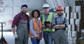 Happy staff posing in a warehouse Royalty Free Stock Photo