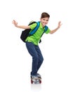 Happy student boy with backpack and skateboard Royalty Free Stock Photo