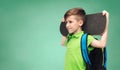 Happy student boy with backpack and skateboard Royalty Free Stock Photo