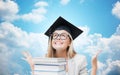Happy student girl in bachelor cap with books Royalty Free Stock Photo