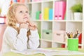 Portrait of happy girl drawing with colorful pencils Royalty Free Stock Photo