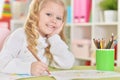 Portrait of happy girl drawing with colorful pencils Royalty Free Stock Photo