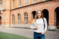 Happy student girl with school bag and notebooks outdoors Royalty Free Stock Photo