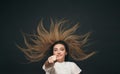 Happy student girl showing up to camera with pencil top view, concept of success and determination