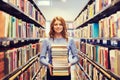 Happy student girl or woman with books in library Royalty Free Stock Photo