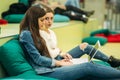 Happy student have a break in university. Have a good time while using phone , tablet and laptop. Two girls Royalty Free Stock Photo