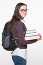 Attractive cheerful young female student holding books, isolated on white background. Education concept Royalty Free Stock Photo