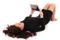 Happy student teenage girl lying on the floor with tablet pc Royalty Free Stock Photo