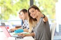 Happy student with thumbs up in a classroom Royalty Free Stock Photo