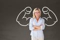 Happy student woman with fists graphic standing against grey blackboard