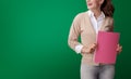 Happy student woman with pink notebook looking at copy space Royalty Free Stock Photo