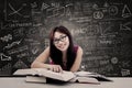 Happy student and written blackboard