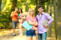 Happy students with books in the Park on a Sunny day. Royalty Free Stock Photo