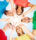 Happy students in colorful clothing standing together making sta Royalty Free Stock Photo