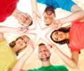 Happy students in colorful clothing standing together making sta Royalty Free Stock Photo