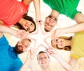 Happy students in colorful clothing standing together making sta Royalty Free Stock Photo