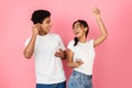 Happy students dancing and listening music by earphones Royalty Free Stock Photo