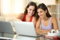 Happy students e-learning with laptops Royalty Free Stock Photo