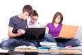 Happy students looking at laptop