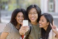 Happy students standing and make selfie outdoors Royalty Free Stock Photo