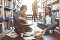 Happy students talking in athenaeum Royalty Free Stock Photo