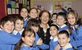 Happy students and teacher in the classroom