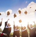 students throwing graduation caps in the Air Royalty Free Stock Photo