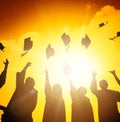 students throwing graduation caps in the Air Royalty Free Stock Photo