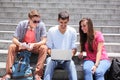 Happy students using digital tablet Royalty Free Stock Photo