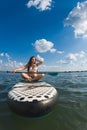 happy stunning woman on supboard