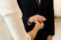 Happy stylish bride and elegant groom exchanging wedding rings at ceremony at church Royalty Free Stock Photo