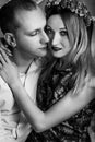 Happy stylish couple hugging and sitting  on background of luxury interior in studio, black white photo Royalty Free Stock Photo