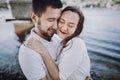 Happy stylish couple in love hugging on the beach in summer cit Royalty Free Stock Photo